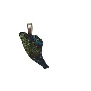 Glass artist signed pendant. Greens blues and purples. Silver toned bail.